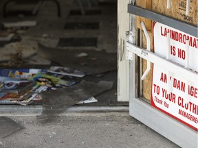 The inside of The Lint Trap Laundromat is seen at 9704 149 Street after a fire in Edmonton, Alberta on Saturday, August 13, 2016. Ian Kucerak / Postmedia