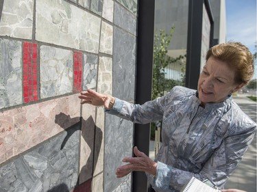 Today marks a construction milestone of the new Royal Alberta Museum. Ernestine Tahedl, is the mosaic panel artist who created the nine panels that previously adorned the Canada Post building on the same site. They have been refurbished and repurposed outside of the new RAM.  Photo by Shaughn Butts / Postmedia  Stuart Thomson story