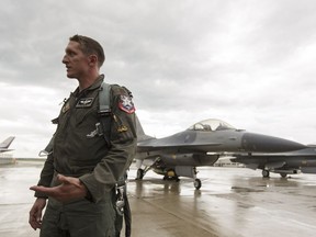 Maj. Craig Baker with the United States Air Force F-16 Viper demo team is interviewed after arriving at Edmonton International Airport in Nisku, Alberta on Wednesday, August 3, 2016.