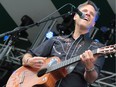 oey Burns of Calexico on mainstage Sunday afternoon at Edmonton Folk Music Festival.