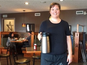 Server Leanne Wood keeps the coffee coming during brunch at Spruce Grove's SandyView Farms Loft Restaurant.