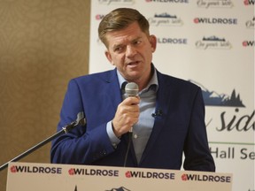 Wildrose Party Leader and Fort McMurray-Conklin MLA Brian Jean speaks to the crowd during a town hall meeting at the Quality Inn in Fort McMurray on Tuesday August 30, 2016.