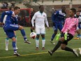 FC Edmonton Ben Fisk can't get the ball past Miami FC goalkeeper Mario Daniel Vega during North American Soccer League action at Clarke Field on Sunday, September 11, 2016 in Edmonton.