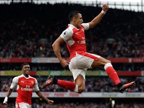 Arsenal&#039;s Alexis Sanchez celebrates after scoring the opening goal during the English Premier League soccer match between Arsenal and Chelsea at the Emirates Stadium in London, Saturday, Sept. 24, 2016. (AP Photo/Matt Dunham)