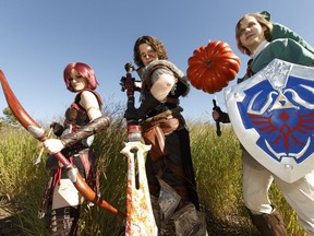 Daina Friend, as Leliana from Dragon Age, Lane Monteith, as Hawke from Dragon Age, and Morgan Tasa as Link from Legend of Zelda, pose for a photo during the Edmonton Comic and Entertainment Expo at the Edmonton Expo Centre on Saturday, September 24, 2016.