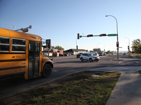 A school bus sits at the light on the corner of Silin Forest Road and Thickwood Blvd. as McMurray's students head back to classes on the first day of a new school year, September 6, 2016. Olivia Condon/ Fort McMurray Today/ Postmedia Network