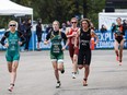 Athletes compete during the run stage during the Elite Women's race at the ITU World Triathlon Edmonton at Hawrelak Park in Edmonton on Sept. 4, 2016.