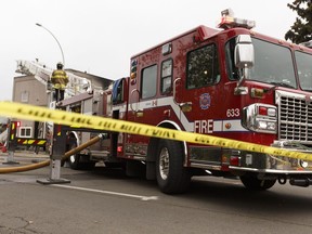 Firefighters put out hot spots after a fire ravaged a building at 11242 86 St. in Edmonton, ALta. on Friday, Sept. 23, 2016. The building is owned by a numbered company operated by notorious landlord Abdullah Shah, who also uses the names Carmen Pervez and Gohar Pervez.