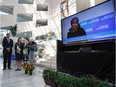 From left: Edmonton Mayor Don Iveson, Alberta Minister for the Status of Women Stephanie McLean and city councillor Bev Esslinger watch a pre-recorded message from Phumzile Mlambo-Ngcuka, executive director of UN Women, as they take part in an announcement that Edmonton will be joining the United Nations Women Safe Cities and Safe Public Spaces Program at City Hall in Edmonton, Alta., on Wednesday, Sept. 7, 2016.