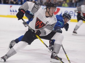 Team North America's Connor McDavid skates to the net as Team Europe's Roman Josi defends during first period of a pre-tournament game at the World Cup of Hockey, Thursday, September 8, 2016 in Quebec City.