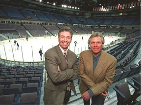 Doug Risebrough, left, was hired by Edmonton Oilers general manager/president Glen Sather, right, to be the team's vice-president of hockey operations on Oct. 21, 1996.