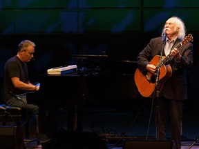 David Crosby (right) performs with his son James Raymond at the Winspear Centre in Edmonton on Monday, Sept. 12, 2016.