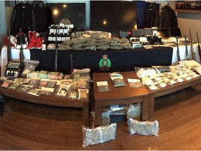 Drugs, cash, goods and firearms seized by Northwest Territories RCMP during an investigation in trafficking that RCMP dubbed Project Green Manalishi.