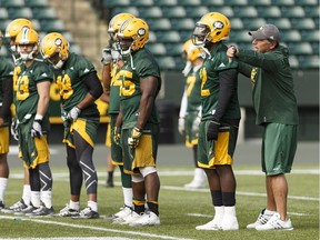 Edmonton Assistant Head Coach / Defensive Coordinator Mike Benevides (right) directs players during Edmonton Eskimos practice at Commonwealth Stadium in Edmonton, Alberta on Thursday, Aug. 18, 2016. The team plays the Toronto Argonauts on Aug. 20. Ian Kucerak / Postmedia