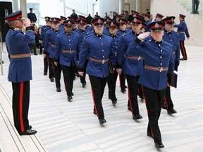 Edmonton Police Chief Rod Knecht (left) salutes Recruit Training Class 130 during their graduation ceremony at Edmonton City Hall on Friday February 13, 2015.