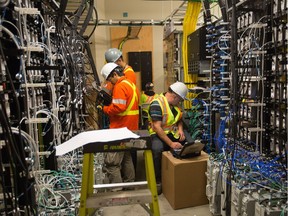 Workers in the building carrier solution room at Rogers Place, in Edmonton Sept.8, 2016. The room houses technology for multiple service providers so cell phones will work in the stadium.