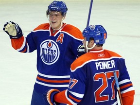 Edmonton Oilers' forwards Ales Hemsky and Dustin Penner celebrate the Oilers' third goal in second period NHL action against the Columbus Blue Jackets at Rexall Place on Oct. 22, 2009.