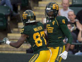 Edmonton Eskimos Adarius Bowman (4) celebrates his touchdown with teammate Derel Walker (87) against the Calgary Stampeders on Saturday, September 10, 2016 in Edmonton. Greg  Southam / Postmedia  (To go with sports story) Photos for stories, columns off Eskimos game appearing in Sunday, Sept. 11 edition.