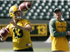 Edmonton Eskimos head coach Jason Maas (right) watches quarterback Mike Reilly (left) at team practice in Edmonton on Wednesday September 14, 2016.