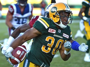 Edmonton Eskimos John White (30) on the run against the Montreal Alouettes during CFL action at Commonwealth Stadium in Edmonton Friday, August 11, 2016.  Ed Kaiser/Edmonton Journal/Postmedia (Edmonton Journal story by Dan Barnes) Photos for stories, columns off Eskimos game appearing in Friday, Aug. 12 edition.