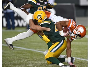 Edmonton Eskimos Neil King (43) takes down BC Lions Bryan Burnham (16) during CFL action at Commonwealth Stadium in Edmonton Friday, September 23, 2016.