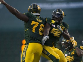 Edmonton Eskimos Phillip Hunt (54) celebrates his sack with Jabari Hunt (76) against the Calgary Stampeders on Saturday, September 10, 2016 in Edmonton. Greg  Southam / Postmedia  (To go with sports story) Photos for stories, columns off Eskimos game appearing in Sunday, Sept. 11 edition.