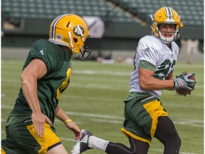 Edmonton Eskimos wide receiver Brandon Zylstra, right, checks his right side while running the ball upfield for  drill during practice at Commonwealth Stadium in Edmonton Alta. on Wednesday June 8, 2016.