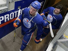 Edmonton Oilers centres Connor McDavid (left) and Ryan Nugent-Hopkins (right) walk to the ice for training camp practice at Rogers Place in Edmonton on Sept. 27, 2016.