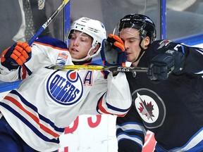 Winnipeg Jets' Micheal Spacek (80) against the bards with Edmonton Oilers' Drake Caggiulla (36) during third period 2016 NHL Young Stars Classic action at the South Okanagan Events Centre in Penticton, B.C., on Sept. 19, 2016.