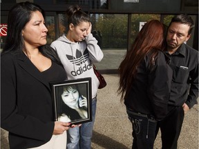 Rebecca Benjamin, second from right, holds a photo of her daughter, Faith Jackson, at the sentencing on Sept. 28, 2016 of Ken Didechko. Jackson was killed in a collision in which Didechko was the driver.