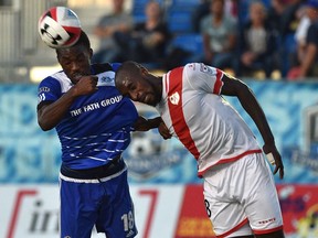 FC Edmonton Tomi Ameobi (18) and Rayo OKC Futty Danso (98) go for the header during NASL action at Clarke Field in Edmonton Thursday, September 14, 2016. Ed Kaiser/Postmedia (Edmonton Journal story by Derek Vandiest) Photos off FC Edmonton game for story running in print Thursday, Sept. 15.