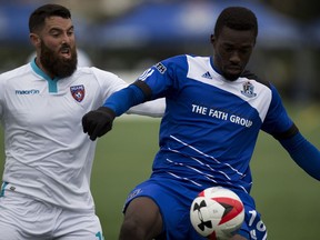 FC Edmonton's Tomi Ameobi keeps the ball from Rhett Bernstein of Miami FC during North American Soccer League action at Clarke Field on Sunday, September 11, 2016 in Edmonton. Greg  Southam / Postmedia  (To go with a Derek Van Diest sports story) Photos off FC Edmonton game for story running in print Monday, Sept. 12.