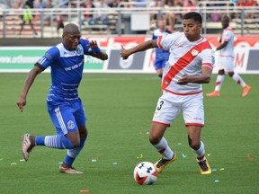 FC Edmonton midfielder Sainey Nyassi challenges Rayo OKC defender Moises Hernandez for the ball Saturday, July 2, 2016 in North American Soccer League play in Oklahoma City. The game ended in a 1-1 tie. Edmonton hosts Rayo OKC at Clarke Stadium on Wednesday.