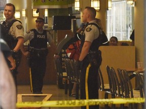 Grande Prairie RCMP were called to a shooting around 5 p.m. at the Prairie Mall on Sept. 15, 2016 in Grande Prairie.  A pool of blood can be seen on the ground in the food court from a gunshot victim as officers discuss what happened. Police are currently