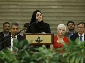 Iman Siddiqui translates verses from the Holy Koran recited by Imam Jamac Hareed during the Celebration of the Muslim Festival of Eid-Al-Adha at the Alberta Legislature in Edmonton, Alberta on Wednesday, September 14, 2016. Ian Kucerak / Postmedia