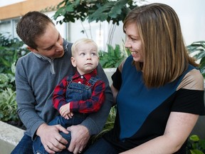 Isaac Tymchuk (2) is pictured with his parents, Matt (left) and Shandra (right) at the Mazankowski Alberta Heart Institute in Edmonton on Sept. 19, 2016. The young toddler from Calgary became the first neonatal cardiac hybrid surgery patient in Western Canada almost two years ago.