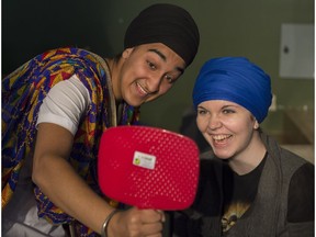 Jagjeet Kaur shows Aylish Anglin her finished turban at the Turban Eh! event at the University of Alberta on Tuesday Sept. 27, 2016.
