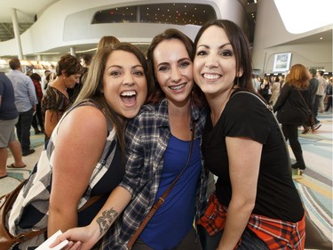 Fans Amy Renneberg, left, Rebecca Raugust, centre,  and Lindsey Lakey heading to the Keith Urban concert at Rogers Place in Edmonton, Alberta on Friday, September 16,