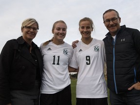 (Left to right) Janice, Kate, Anna and John Dunn pose for a photo after the University of Alberta Pandas played the University of Manitoba Bisons at Foote Field in Edmonton, Alberta on Friday, September 9, 2016. The Dunns have a close familial connection to the University of Alberta. Ian Kucerak / Postmedia (For Jason Hills feature story)