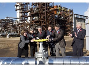 From left, Alberta Minister of Energy Marg McCuaig-Boyd, Shell Canada President Lorraine Mitchelmore, CEO of Royal Dutch Shell Ben van Beurden, Marathon Oil Executive Brian Maynard, Shell ER Manager, Stephen Velthuizen, and British High Commissioner to Canada Howard Drake open the valve to the Quest carbon capture and storage facility in Fort Saskatchewan Alta, on Friday November 6, 2015. Quest is designed to capture and safely store more than one million tonnes of CO2 each year an equivalent to the emissions from about 250,000 cars.