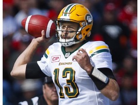 Edmonton Eskimos quarterback Mike Reilly throws the ball during first half CFL football action against the Calgary Stampeders in Calgary, Monday, Sept. 5, 2016.