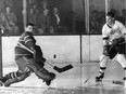 Canadiens goalie Gerry McNeil makes a save on a young Gordie Howe in the early 1950s. McNeil's  son has written a book called  In the Pressure of the Moment.