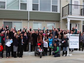 Six families received keys to homes at Neufeld Landing on Friday, September 23, thanks to Habitat for Humanity.