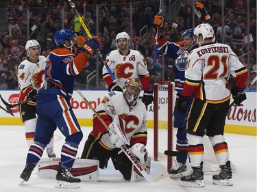 The Edmonton Oilers' Mitchell Moroz (53) and Iiro Pakarinen (26) celebrate Pakarinen's goal against the Calgary Flames during first period pre-season NHL action at Rogers Place, in Edmonton on Monday Sept. 26, 2016.