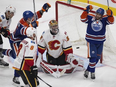 The Edmonton Oilers' Ryan Vesce (59 right) scores  scores a goal against the Calgary Flames during third period pre-season NHL action at Rogers Place, in Edmonton on Monday Sept. 26, 2016.