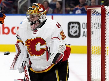 Calgary Flames' goaltender Jon Gillies (32) makes a save against the Edmonton Oilers during first period pre-season NHL action at Rogers Place, in Edmonton on Monday Sept. 26, 2016.