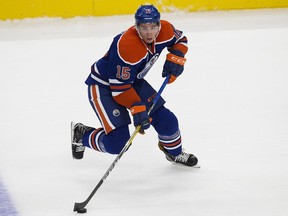 The Edmonton Oilers' Tyler Pitlick (15) battles the Calgary Flames' during third period pre-season NHL action at Rogers Place, in Edmonton on Monday Sept. 26, 2016. The Oilers won 4-2. Photo by David Bloom