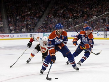 The Edmonton Oilers' Jordan Eberle (14) looks for a shot against the Calgary Flames during first period pre-season NHL action at Rogers Place, in Edmonton on Monday Sept. 26, 2016.