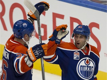 The Edmonton Oilers' Iiro Pakarinen (26) and Ryan Vesce (59) celebrate Vesce's goal against the Calgary Flames during third period pre-season NHL action at Rogers Place, in Edmonton on Monday Sept. 26, 2016.