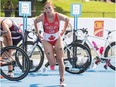 Canada's Paula Findlay transitions from cycling to running during the Women's Triathlon at the Pan Am Games in Toronto, Saturday, July 11, 2015.